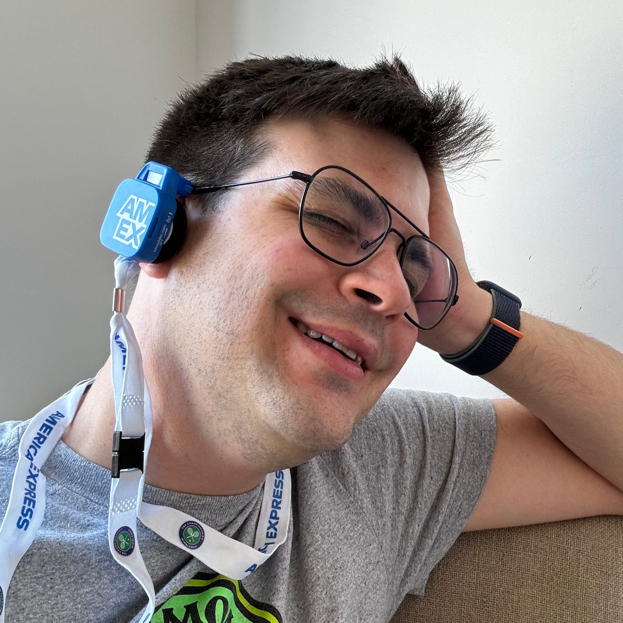 The author sits and laughs with the SoundDec DualTone radio clipped to his ear.