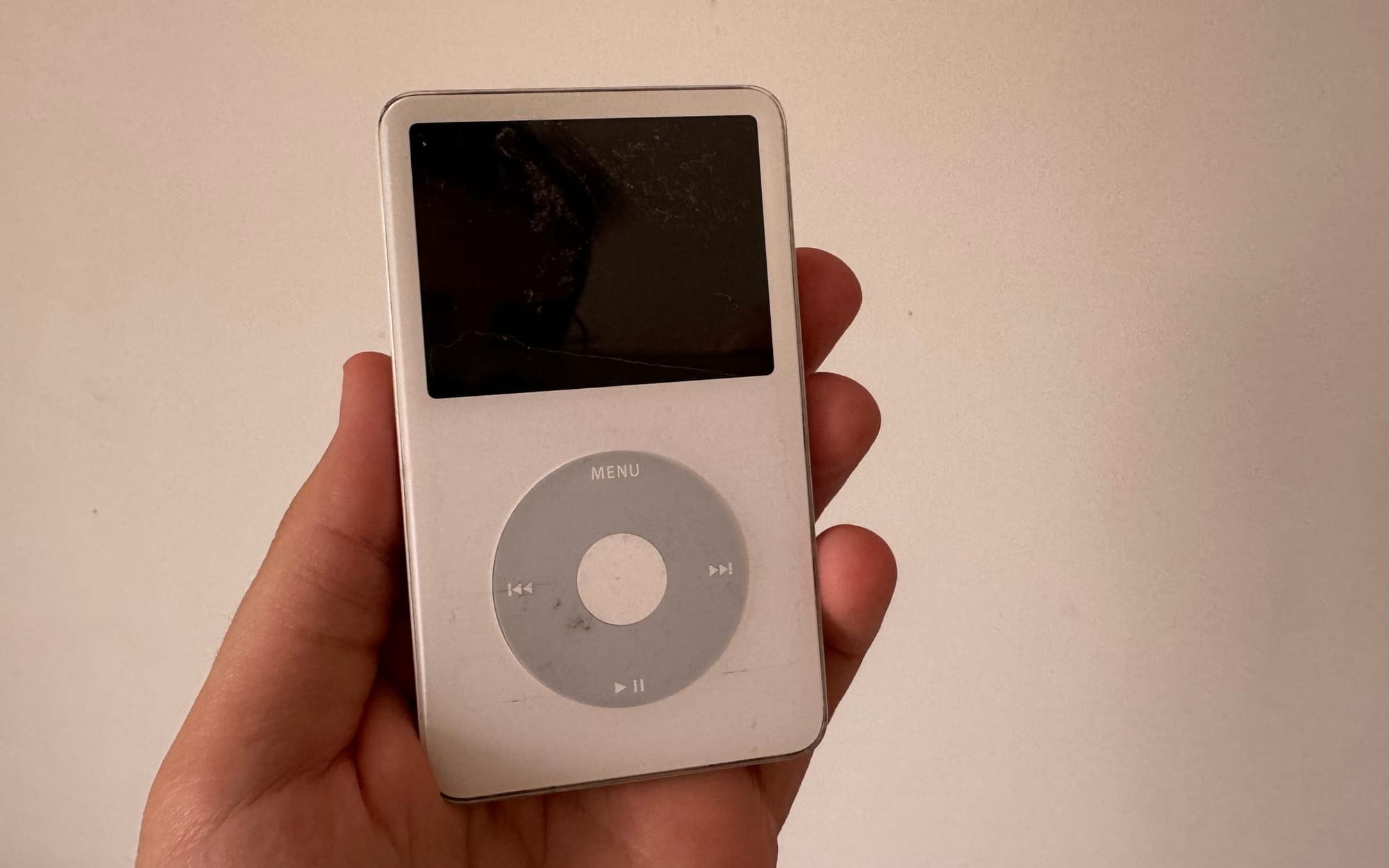 The author's hand holding up the iPod video he purchased on eBay.