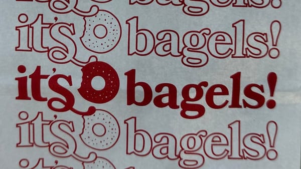 The "It's Bagels!" bagel shop logo on their packaging.
