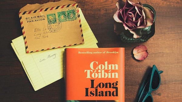 A copy of Colm Tóibín's "Long Island" on a desk along with an Air Mail letter.